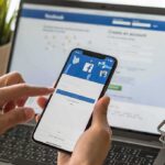 Hands using a smartphone with a social media login screen