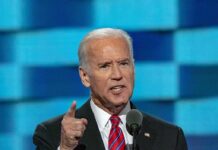 Biden’s “Greatest Mistake”? Hunter Drops Bomb Man in suit speaking at a podium