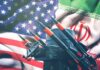 Missile launchers in front of U.S. and Iranian flags