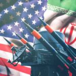 Missile launchers in front of U.S. and Iranian flags