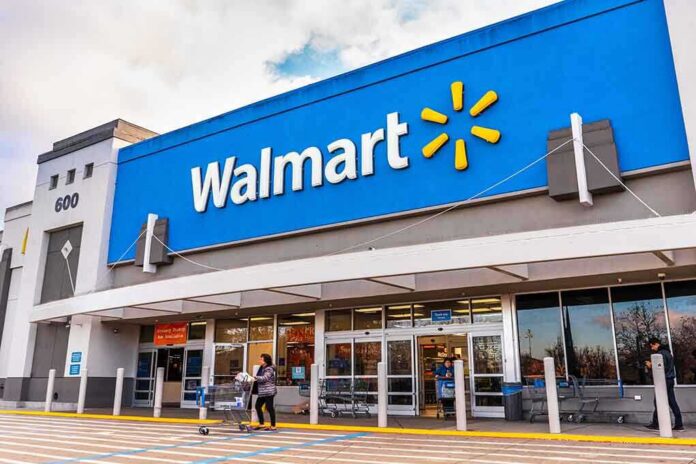 shutterstock_1643463436-1- Exterior view of a Walmart store with customers entering
