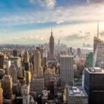 Rooftop Daredevils Expose NYC Weak Link Aerial view of New York City skyline featuring the Empire State Building at sunset