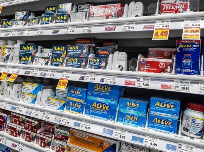Pharmacy shelf with over-the-counter pain relievers