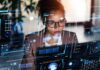 A woman analyzing data on a futuristic digital interface