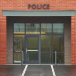 Entrance of a modern police station with brick facade