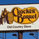 Culture War MELTDOWN At Cracker Barrel Cracker Barrel roadside sign with logo against blue sky