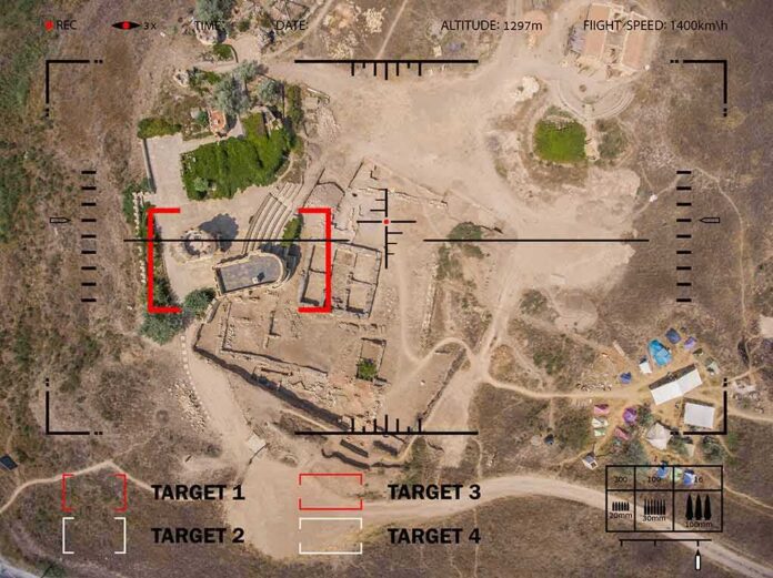 Aerial view through drone HUD of archaeological ruins and surrounding campsite