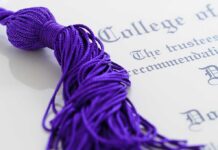 Culture War Engulfs Campus — Trust Collapses Close-up of a purple graduation tassel next to a diploma