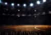 Basketball court under bright arena lights