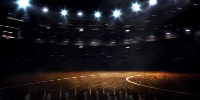 Basketball court under bright arena lights