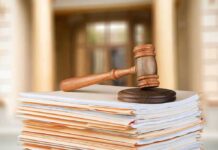 Basement Scene SHOCKS — Intent Or Insanity? judge's gavel resting on a stack of case files