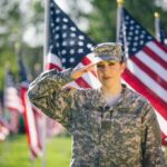 Soldier saluting among American flags