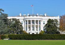 The White House with the American flag flying in front