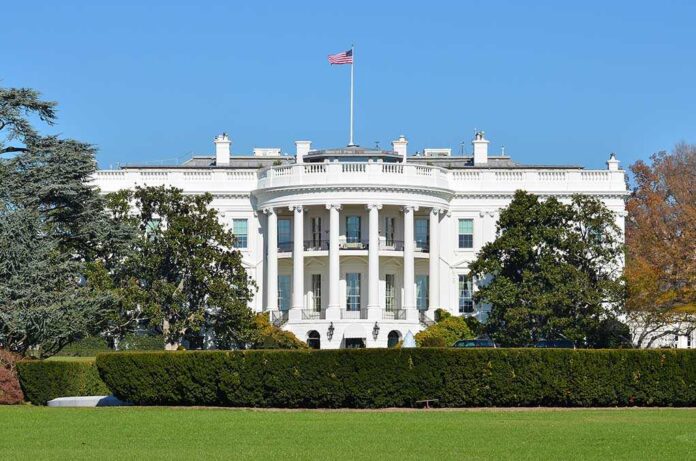 The,White,House,-,Washington,Dc,United,States The White House with the American flag flying in front