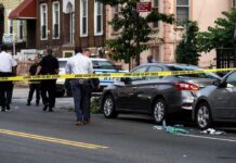 Brooks Road Bloodbath—Then Officials Go Dark Police at urban street crime scene with yellow tape around parked cars