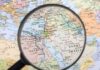 Magnifying glass over Middle East map