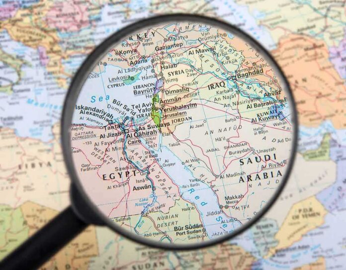 Magnifying glass over Middle East map