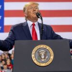 Deal Or Dud: Trump Reopens Kim Channel speaker at podium with U.S. flag backdrop