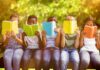 Blue Line Barrier: Scholarships Halted Children sitting on a bench reading colorful books outdoors