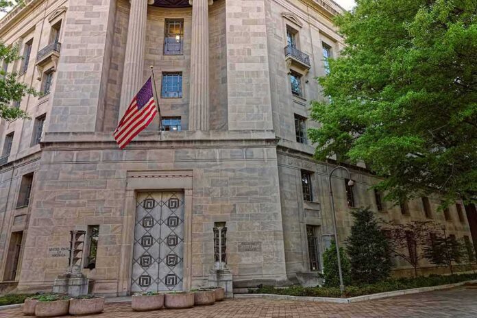 shutterstock_466879760 Stone government building with American flag at entrance