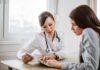 Fox Editor’s Harrowing Cancer Reality Doctor consulting a patient at a desk