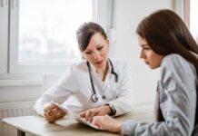 Doctor consulting a patient at a desk