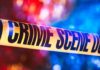 Police Find Chilling Scene With Young Child Crime scene tape with blurred emergency lights in background