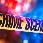 Police Find Chilling Scene With Young Child Crime scene tape with blurred emergency lights in background