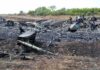 Drunk Pilots Crash Jet – Arrests Follow Airplane crash debris scattered across a burned field