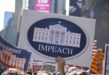 Impeachment Fever Hits Capitol Protest crowd holding an impeach sign with the White House emblem