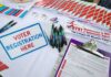 Volatile LA Race Upends Assumptions Voter registration table with forms, pens, and informational materials