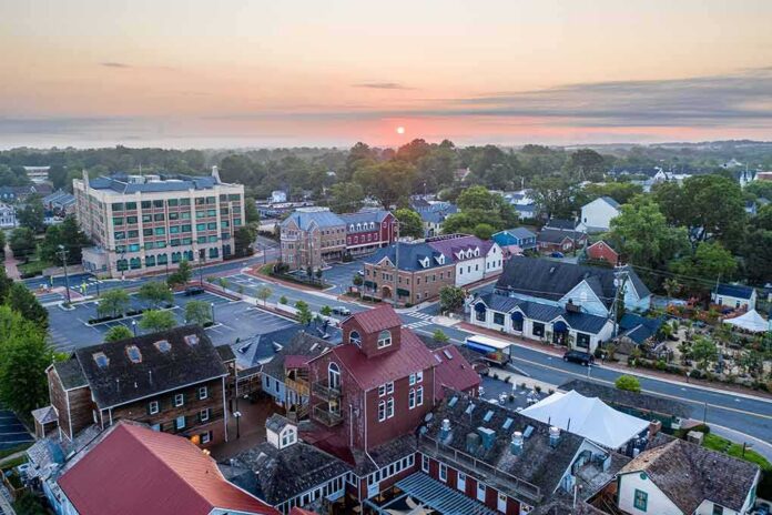 shutterstock_2003854799 Small town at sunrise with historic buildings and tree-lined streets