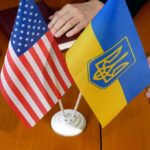 U.S. and Ukrainian flags on a table