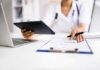 Risky Mix Flagged – Overdose Fears Force Signatures Healthcare worker using tablet and filling out form