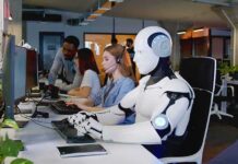 Tech Titans Warn – Vance Pushes Back Robot and office workers at computers in a modern workspace