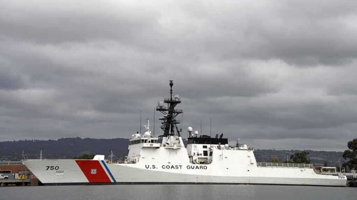 shutterstock_229880047 A U.S. Coast Guard ship docked under cloudy skies