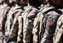 NATO Line Hardens – New U.S. Battalion Arrives Soldiers in camouflage uniforms standing in formation