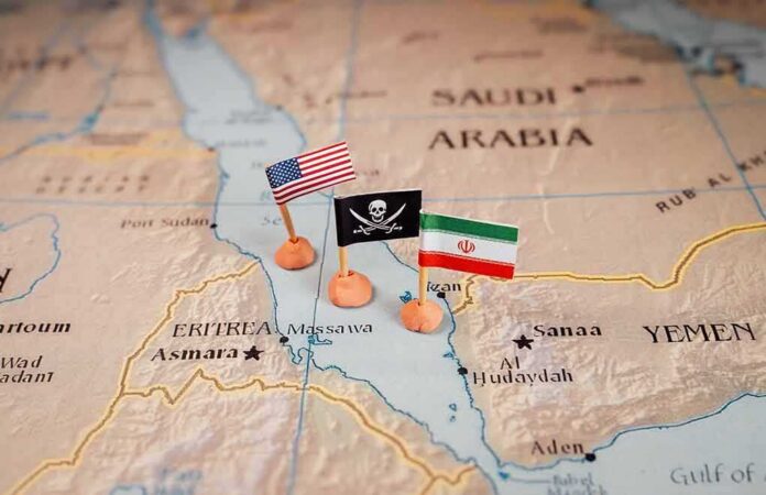 shutterstock_2411562673 Map with US, pirate, and Iran flags near the Red Sea