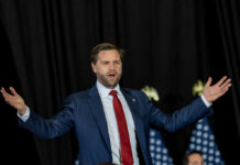 Vance Slams ‘Forever War’ Funding man in suit speaking with arms outstretched