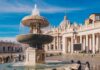 Church Massacre Sparks Terror Hunt Stone fountain in front of a grand basilica with dome and colonnade