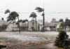 Gulf Coast Braces: Isaias Turns Menacing Houses battered by hurricane winds and flooding