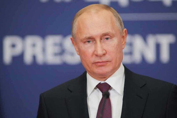 shutterstock_1287905686 Vladimir Putin at a podium with microphone