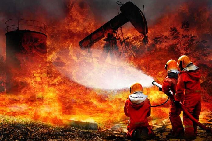 shutterstock_1322856152 Firefighters battling a large industrial blaze