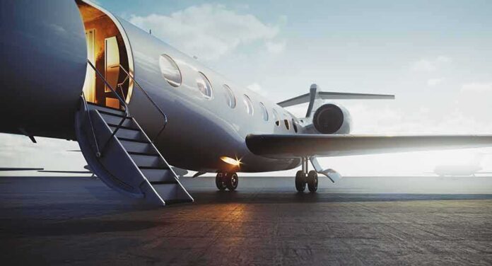 shutterstock_1500547778 Private jet on tarmac with open door and stairs