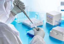 DNA Bombshell Ties Ted Bundy To 1974 Murder Scientist in PPE using a pipette in a COVID-19 PCR testing setup