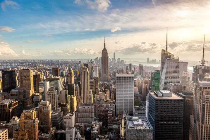 Aerial view of New York City skyline featuring the Empire State Building at sunset