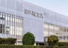 SpaceX headquarters exterior with large logo and windows