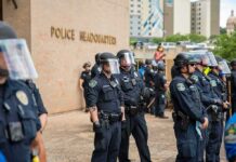 Accused Rapist Could Run the Police Teddy Williams and Carlos Hyde among police officers in riot gear outside police headquarters