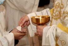 Pope’s Rapid Surgery Plan Raises Big Questions Priest gives communion wafer to a congregant