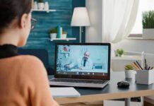 Medicare Heist Exposed: Telehealth Kingpin Nailed Woman on laptop having video call with doctor in home office